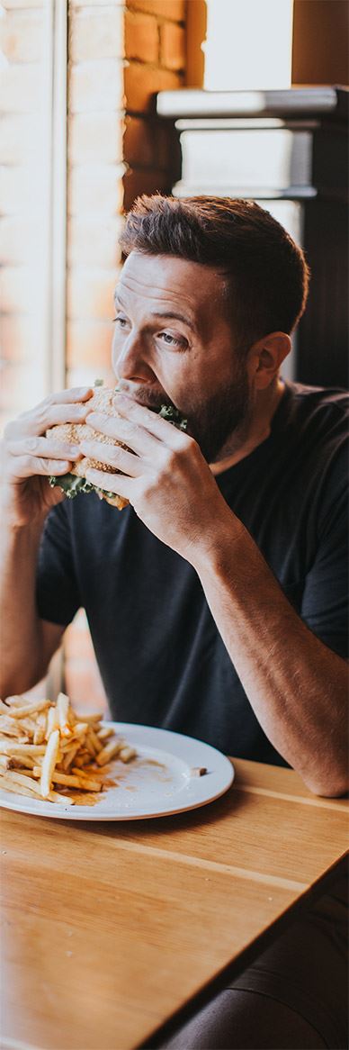 A regular enjoying a burger